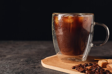 Cup of iced coffee on dark background