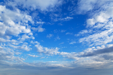 Deep blue sky in the morning with white clouds feathers