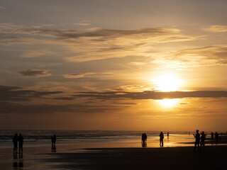 Sunset, Silhouette of people in Parangtritis Beach, Bantul, Yogyakarta Indonesia 