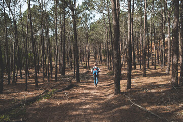 Person hiking through a mediterranean forest