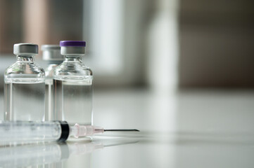 Selective Focus of Syringe and Medicine in vial , ready for vaccine injection , Cancer Treatment , Pain Treatment and can also be abused for an illegal use, healthcare and medical concept vaccination.