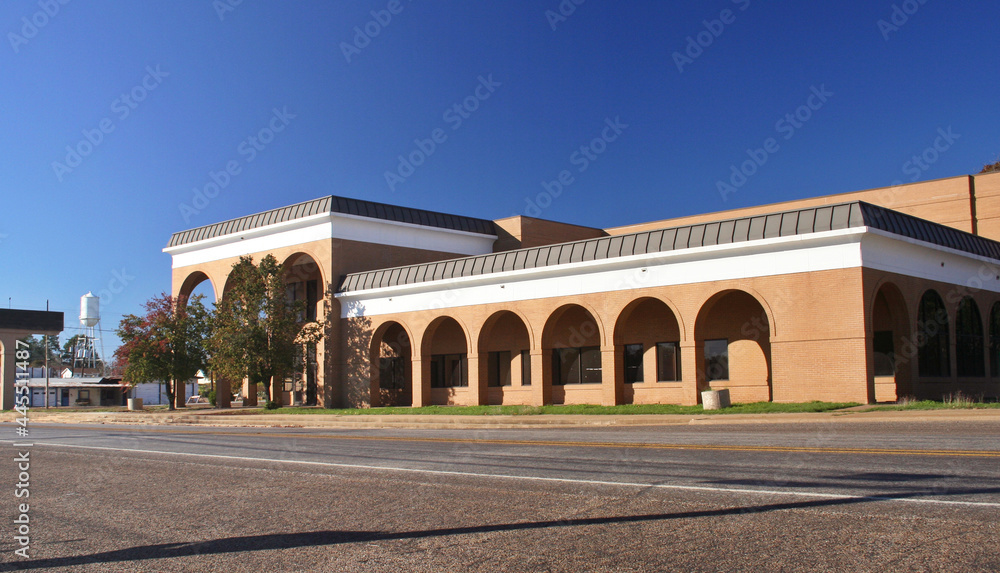 Wall mural scenic view of historic buildings in a rural small town in east texas under a clear blue sky