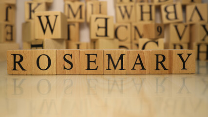 The word Rosemary was created from wooden letter cubes. Gastronomy and spices.