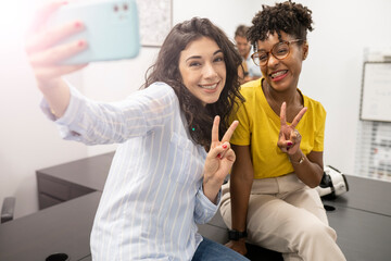 two women in coworking resting talking