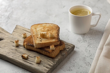 cup of tea with lemon and bread