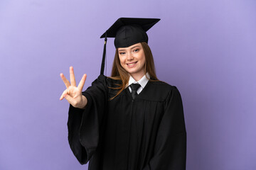 Young university graduate over isolated purple background happy and counting three with fingers