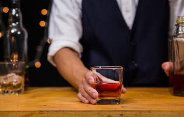 Bartender Serve Whiskey, on wood bar, 