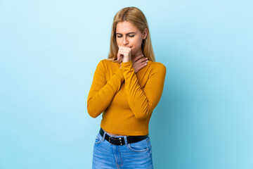 Young Uruguayan blonde woman over isolated blue background coughing a lot