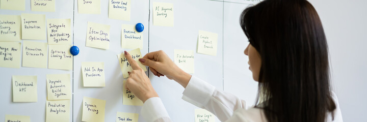 Woman Writing On Sticky Notes