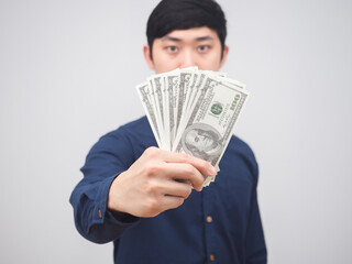 Closeup money in man hand on white background,Businessman show money in hand get salary concept