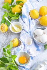 Ingredients for making traditional homemade lemon cake, fresh summer baking items