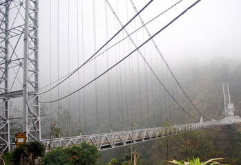 Man-made metal bridge known as Singshore Bridge in West Sikkim with 100 m height and 240 m length,...