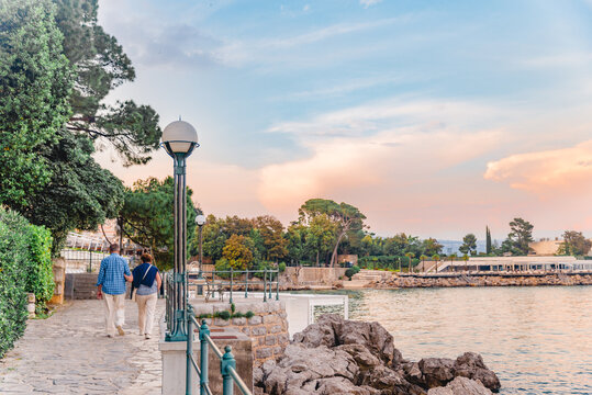 Opatija, Croatia - June 4, 2019: senior couple walking by city quay - Powered by Adobe
