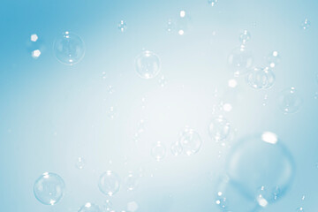 Blur Transparent Blue Soap Bubbles Floating on White Background. Cpoy Space.