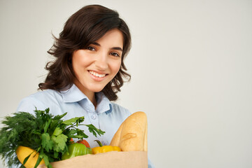 woman with a package of vegetables groceries supermarket close-up