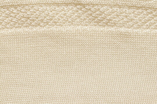 Beige texture of fabric for socks. Fabric texture. 