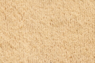 Fototapeta na wymiar The texture of the beige carpet. Carpet texture. 