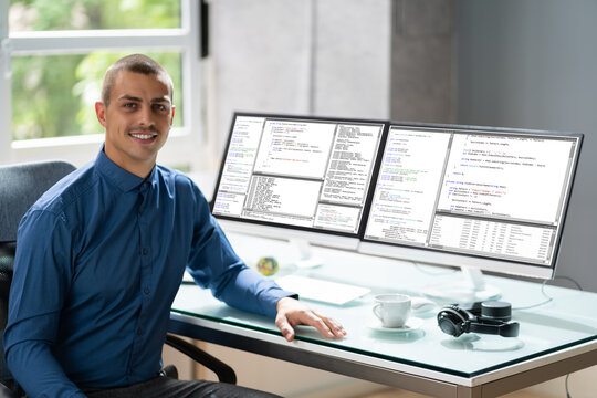 Computer Programmer Writing Program Code On Computer