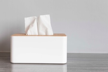 Fototapeta na wymiar Square white wooden box for tissue paper towels