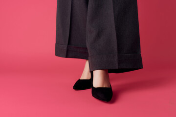 female legs in black pants shoes posing elegant style fashion