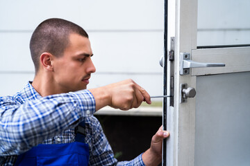 Locksmith Lock Door Repair. Worker Changing