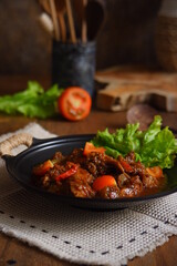 a plate of chicken meat cooked in spicy 