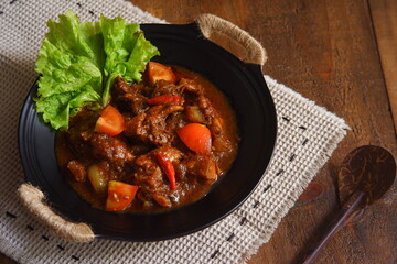 a plate of chicken meat cooked in spicy 