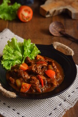 a plate of chicken meat cooked in spicy 