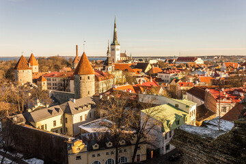Fototapeta na wymiar Tallinn, Estonia. Aerial view at sunset of the Old Town with the Church of St Olaf and the towers. A World Heritage Site