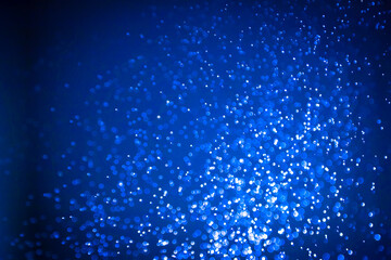 Beautiful abstract blue bokeh with black background