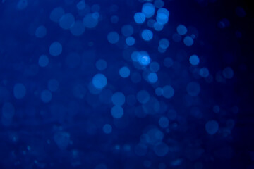 Abstract blue bokeh with black background