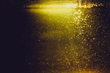 Golden bokeh of lights with black background