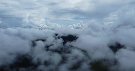 Aerial view white clouds. View from drone. Aerial view cloudscape. View from above. Sunrise or sunset over clouds.