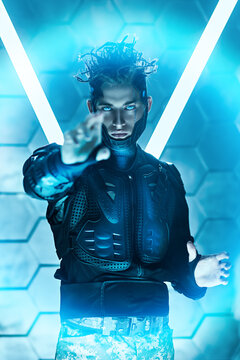 cyborg stands touching virtual wall