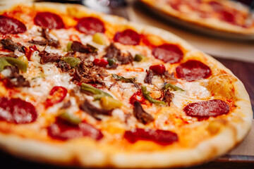 Hot Pepperoni Pizza with Mozzarella cheese, salami, Tomato sauce, pepper, Spices. Italian pizza