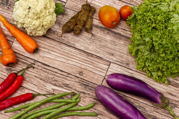 vegetables on wooden background for copy space, photography background, etc.