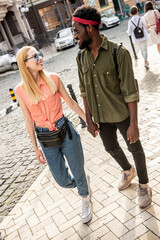 The couple walks around the city