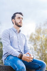 Portrait of a man businessman with a beard who sits and rests