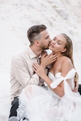 Beautiful wedding couple bride and groom at wedding day outdoors at ocean beach. Happy marriage couple o