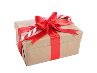 Christmas gift box decorated with red bow and candy cane on white background