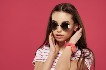 pretty brunette sunglasses modern style model pink background
