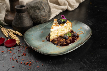 Cheesecake with blueberries and berry sauce