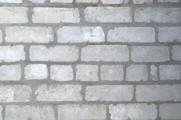 The texture of a brick wall. Grey brick and cement