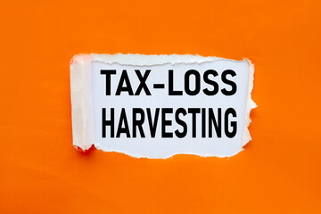 Tax-Loss Harvesting, text on torn paper. test in black letters