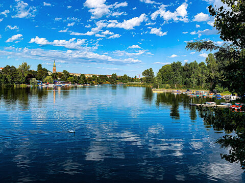 Beautiful day with a bright sky filled with white clouds over a lovely lake in the Setagaya Park