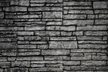 Black old brick wall. Collapsing brickwork. Grunge background with copy space for design. Distressed background.