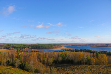 View from a height of the lake and forest in autumn.