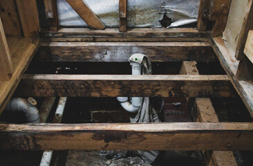 exposed floor structure with timber trusses during shower renovation, home renovations and tradesman work