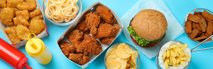 Concept of fast food on blue background