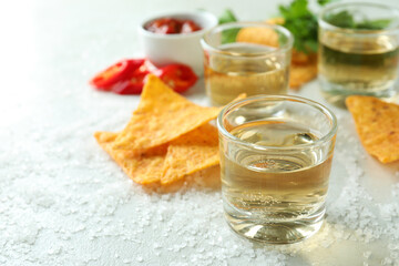 Party concept with tequila, guacamole and chips
